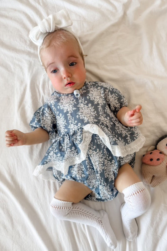 Baby girls blue and white floral romper with broderie detail ruffle