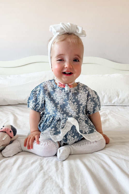 Baby girls blue and white floral romper with broderie detail ruffle