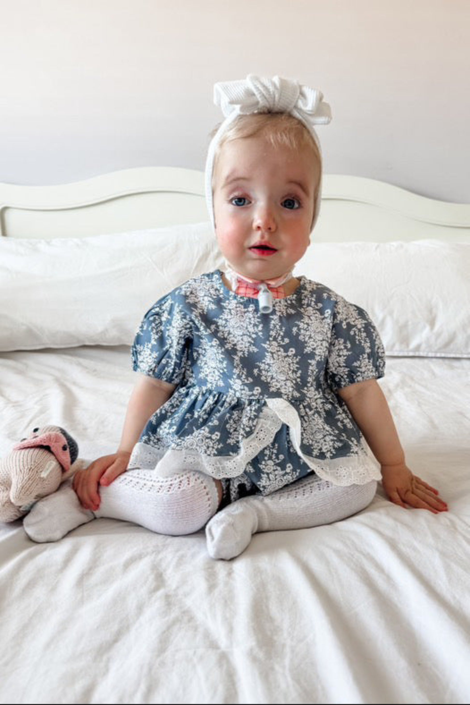 Baby girls blue and white floral romper with broderie detail ruffle