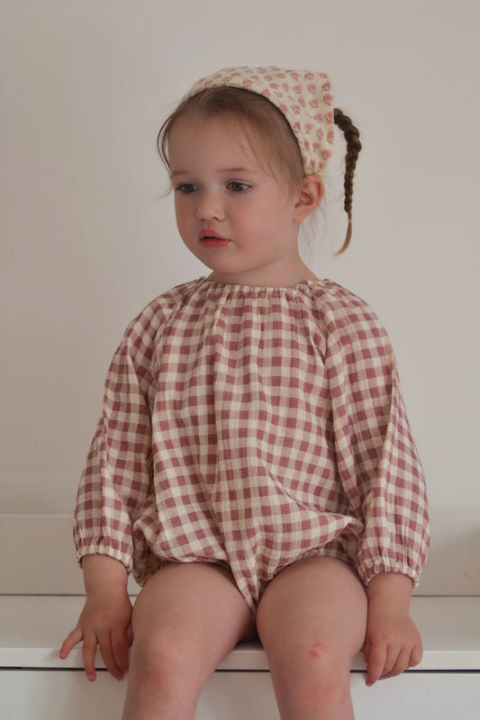 baby toddler girls long sleeved romper in a dark pink and cream gingham print. elasticated neck and sleeves