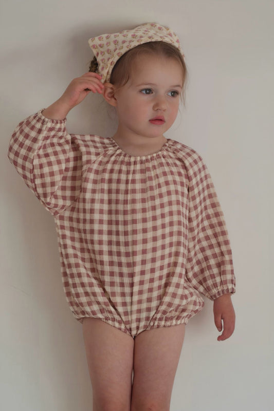 baby toddler girls long sleeved romper in a dark pink and cream gingham print. elasticated neck and sleeves